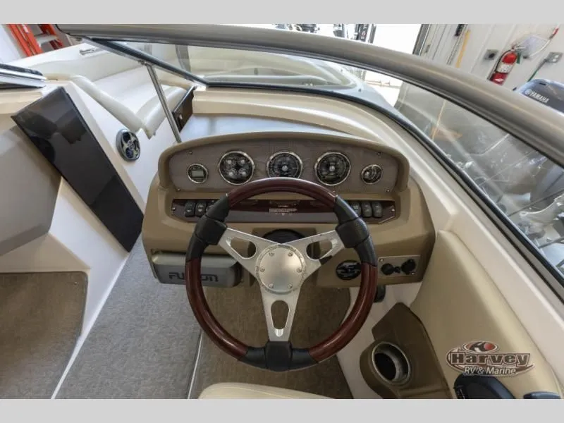 Slide: The Image of Interior view of a 2014 Regal 2000 boat with dashboard and steering wheel. - 20