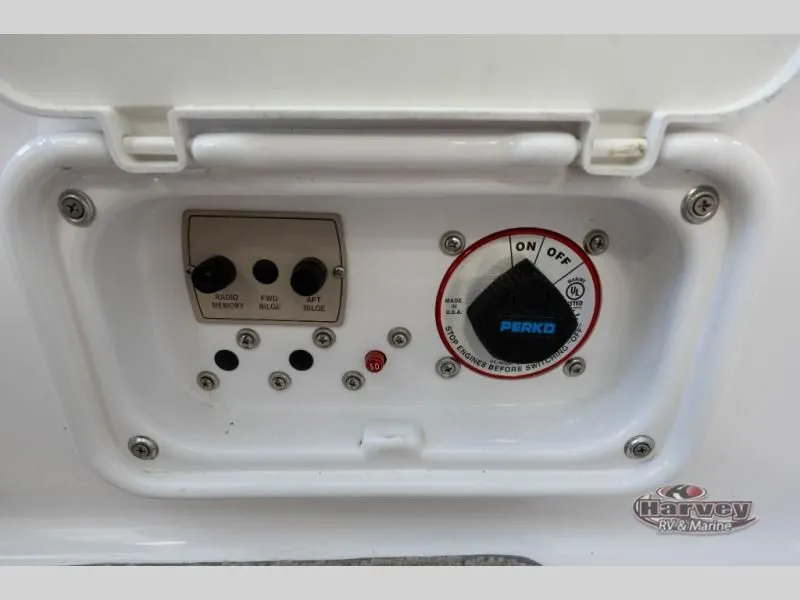 Slide: The Image of Regal 2000 boat control panel, 2014 model, featuring switches and Perko dial. - 22