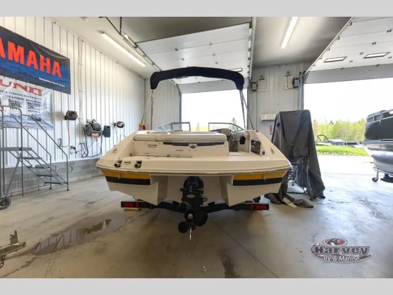 Slide: The Image of 2014 Regal 2000 boat in a workshop setting. - 4