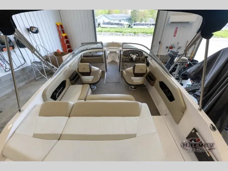 Slide: The Image of Interior view of a 2014 Regal 2000 boat in a garage. - 7