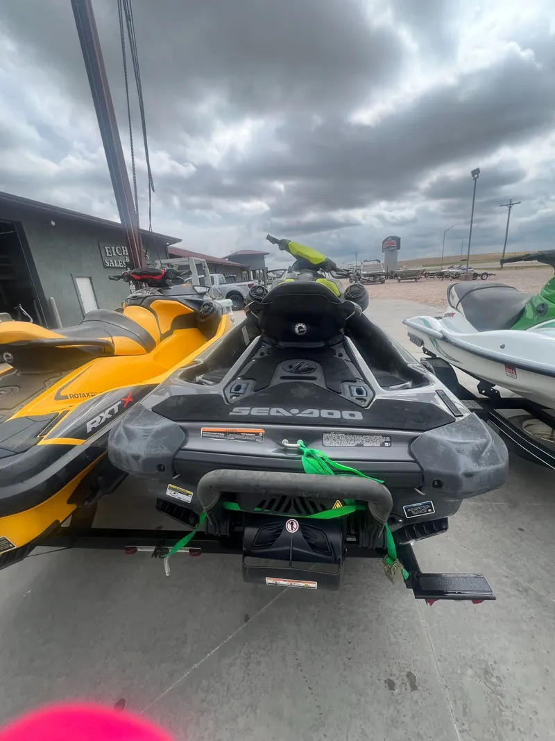 Slide: The Image of 2021 Sea-Doo GTR 230 iBR with sound system in parking lot. - 2