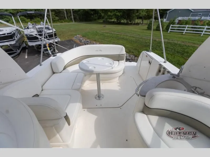 Slide: The Image of Interior of a 2005 SUNDANCER 260 yacht with white seating. - 10