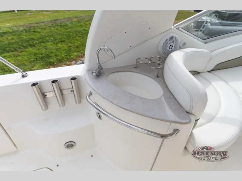 Slide: The Image of Interior of a 2005 SUNDANCER 260 with sink and seating area. - 11