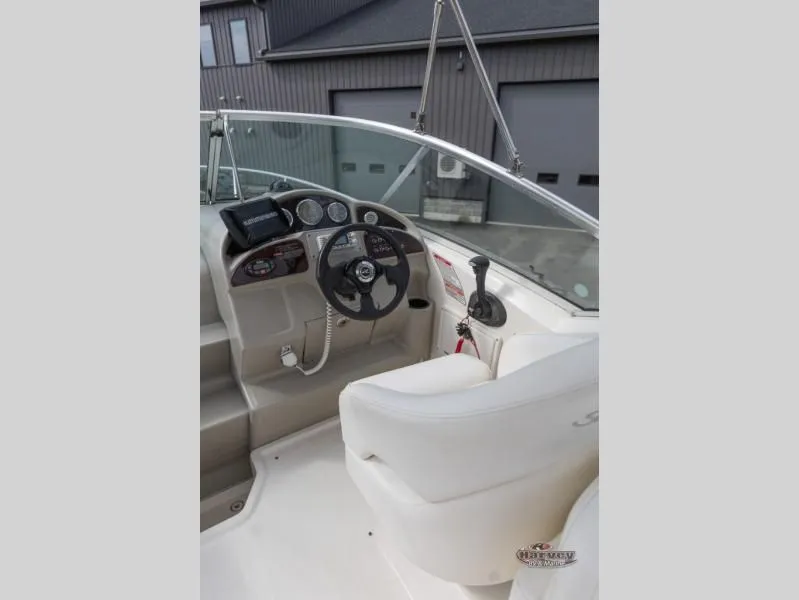 Slide: The Image of Interior view of a 2005 SUNDANCER 260 boat cockpit. - 13