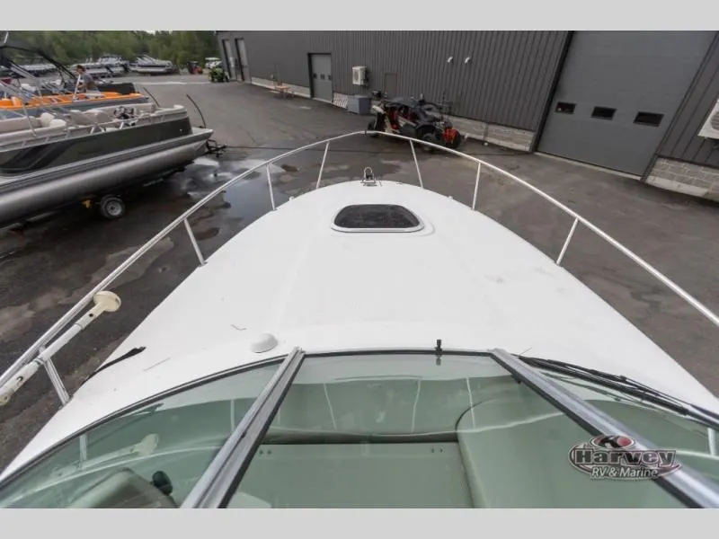 Slide: The Image of 2005 SUNDANCER 260 boat deck at a marina. - 19
