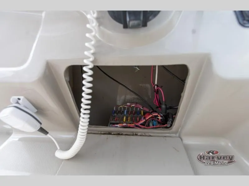 Slide: The Image of Electrical compartment of a 2005 SUNDANCER 260 boat with wires and fuses. - 20