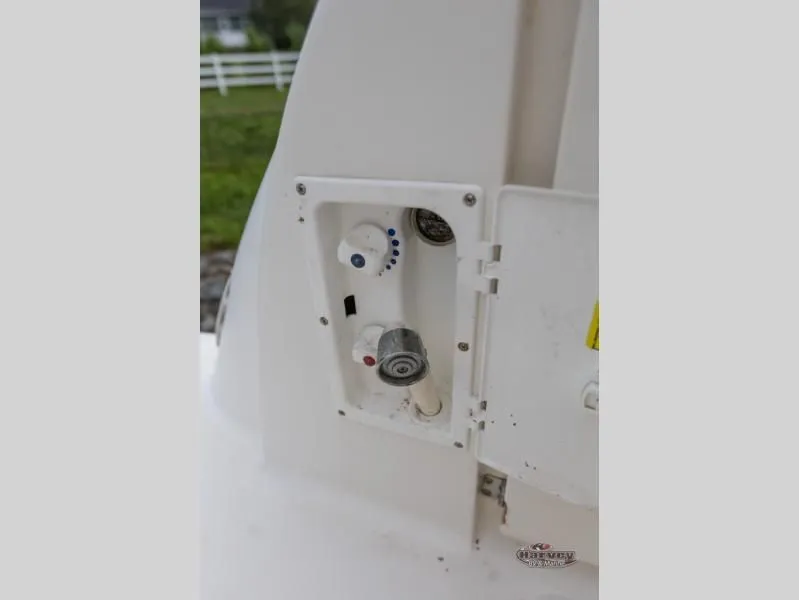 Slide: The Image of Water valve and shower head on a 2005 SUNDANCER 260 boat. - 22
