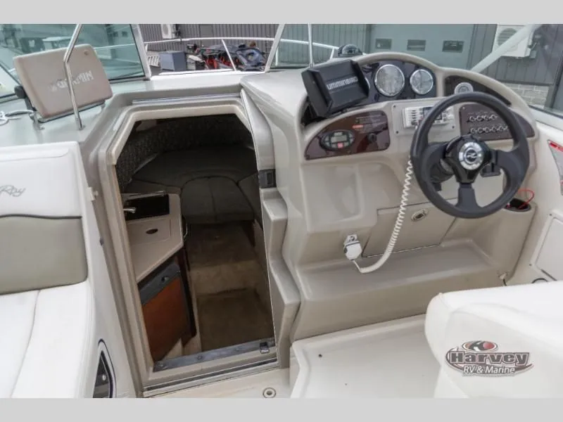 Slide: The Image of Interior view of a 2005 SUNDANCER 260 boat with helm station. - 25