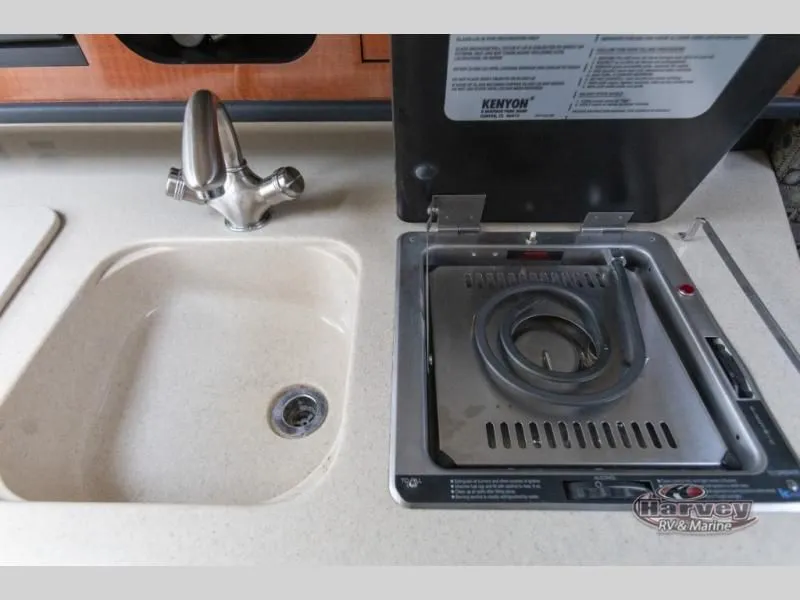 Slide: The Image of 2005 SUNDANCER 260 boat kitchenette with sink and stove. - 30