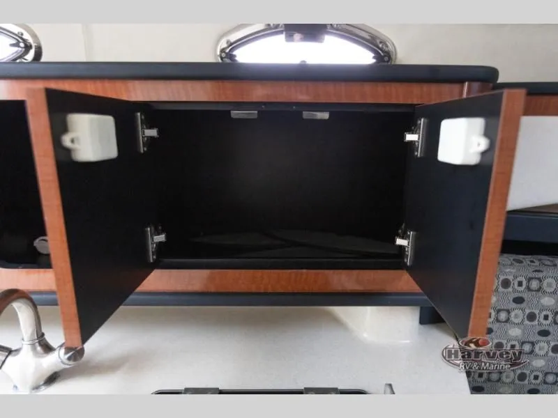 Slide: The Image of Open cabinet in 2005 SUNDANCER 260 boat interior. - 31