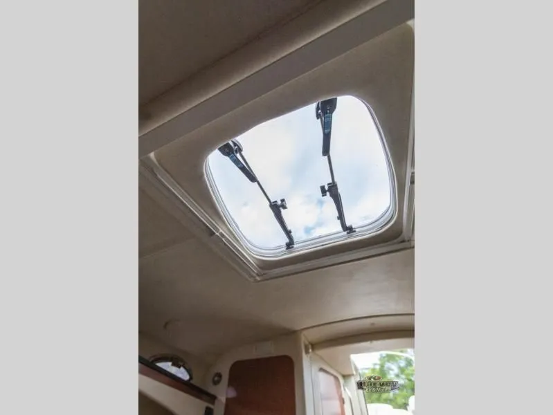 Slide: The Image of SUNDANCER 260 2005 skylight view of the sky. - 33