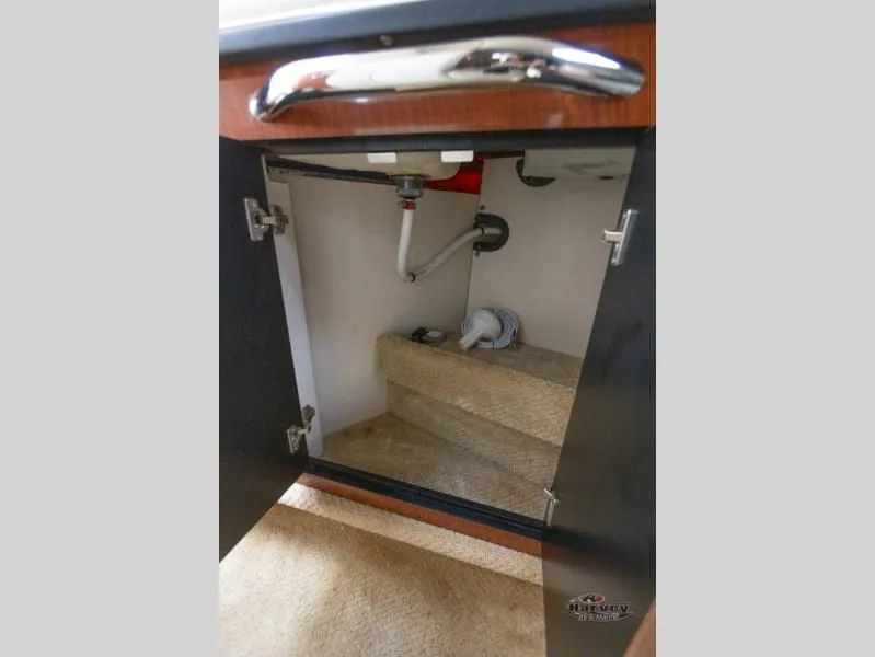 Slide: The Image of Open cabinet in 2005 SUNDANCER 260 boat. - 35