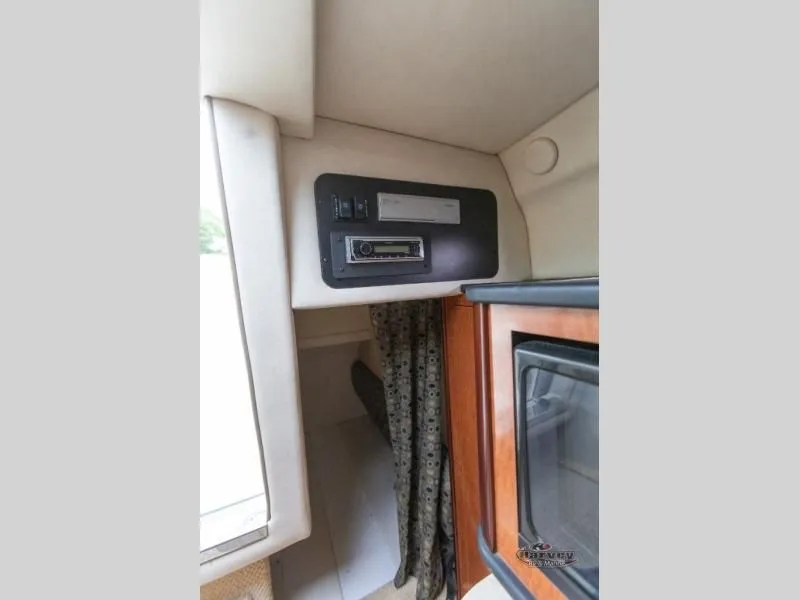 Slide: The Image of Interior of 2005 SUNDANCER 260 with stereo system and curtain. - 36