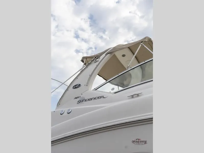 Slide: The Image of 2005 SUNDANCER 260 boat under cloudy sky. - 4