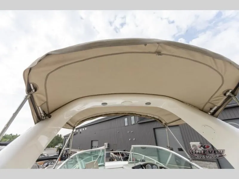 Slide: The Image of 2005 SUNDANCER 260 boat with canopy, exterior view. - 42