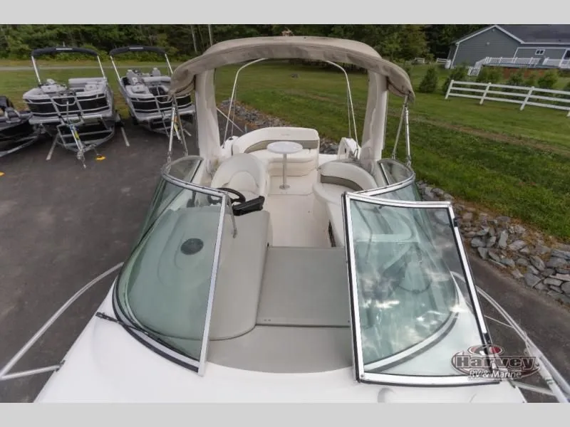 Slide: The Image of 2005 SUNDANCER 260 boat with open cockpit and canopy. - 6