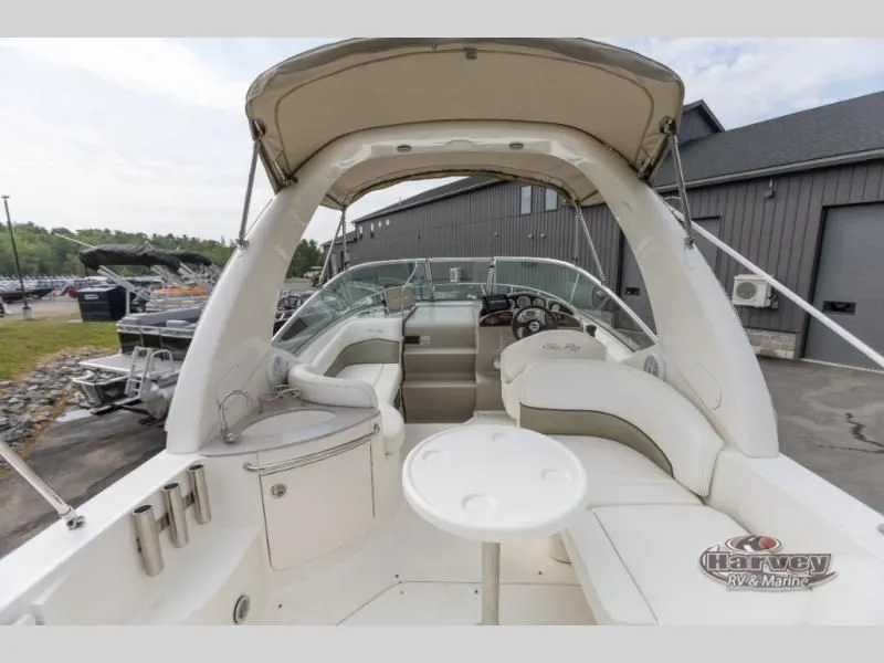 Slide: The Image of Interior view of a 2005 SUNDANCER 260 boat with seating area. - 7