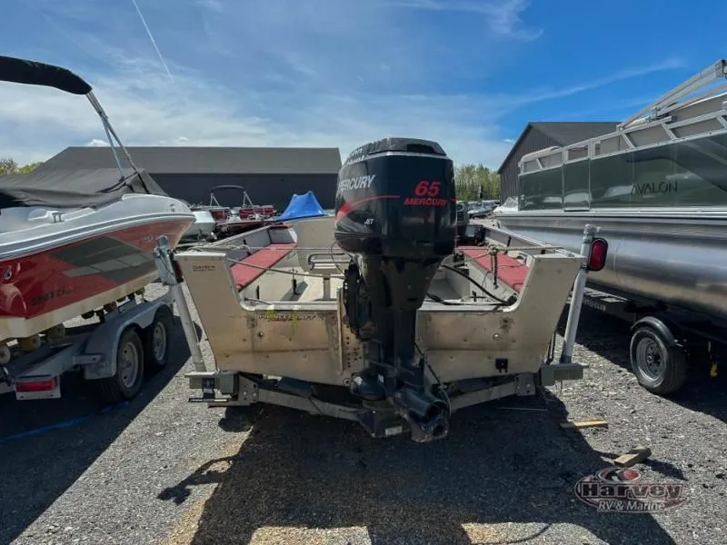 Slide: The Image of 2002 Hudson 19 DLX boat with Mercury 65 engine in parking lot. - 3