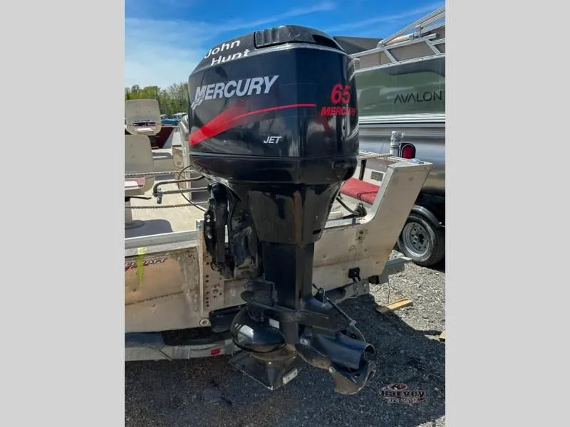 Slide: The Image of Mercury 65 Jet outboard motor on a 2002 Hudson 19 DLX boat. - 4