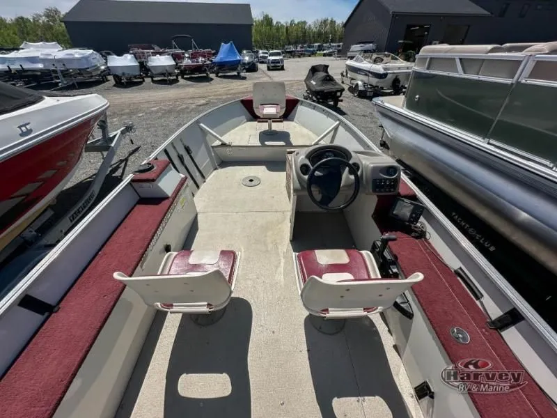 Slide: The Image of Interior view of a 2002 Hudson 19 DLX boat at a marina. - 7