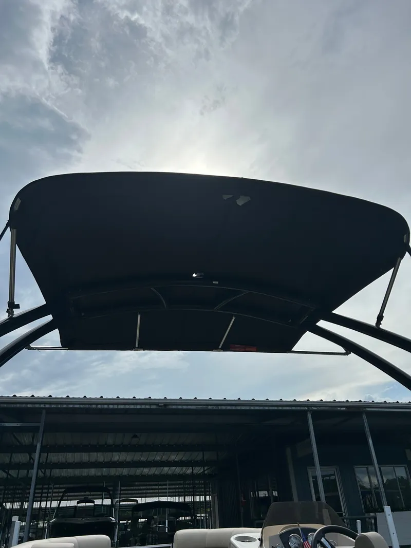 Slide: The Image of 2020 Harris Sunliner 250 boat with sun canopy. - 12