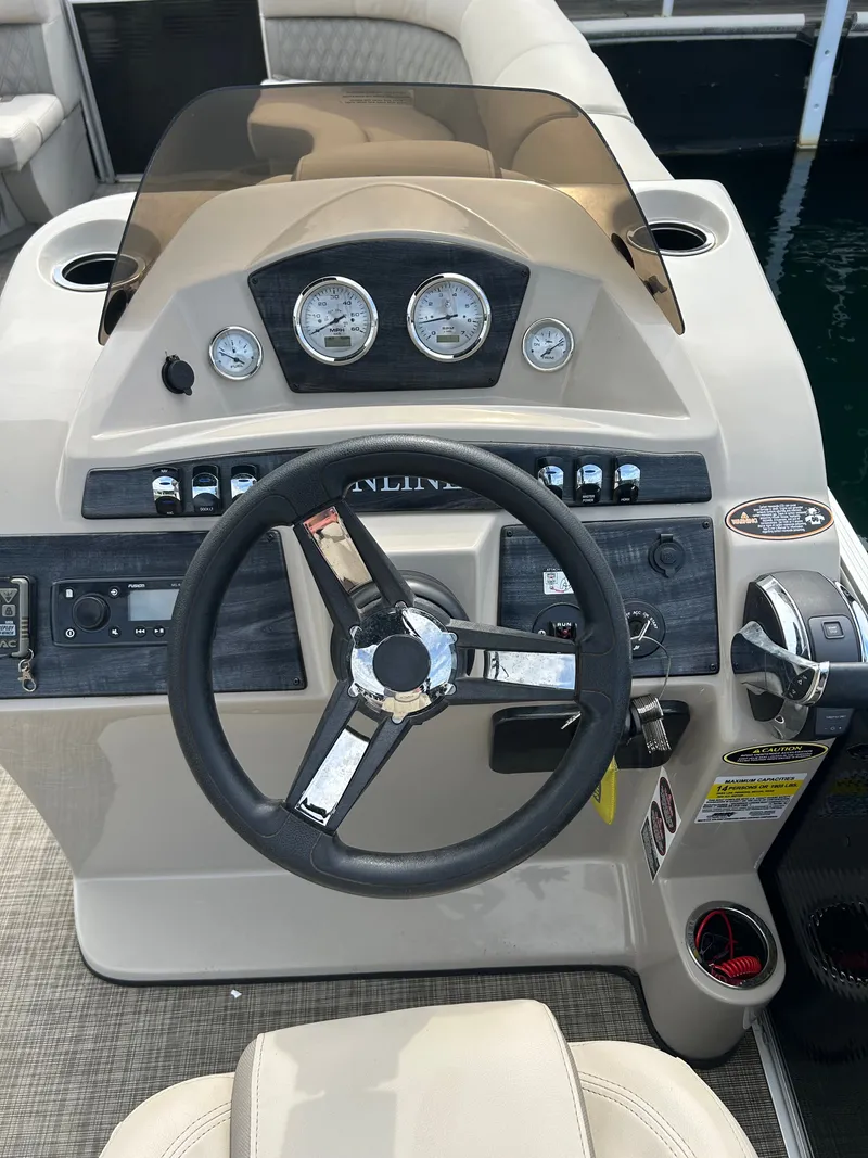 Slide: The Image of Dashboard of a 2020 Harris Sunliner 250 pontoon boat. - 7