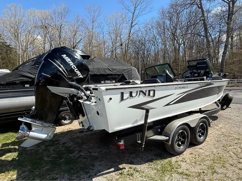 The Image of 2020 Lund 2175PROV boat with Mercury engine parked outdoors. - 1