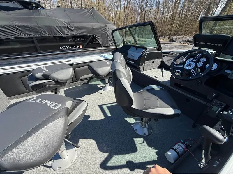 Slide: The Image of Interior of a 2020 Lund 2175PROV boat with seats and control console. - 4