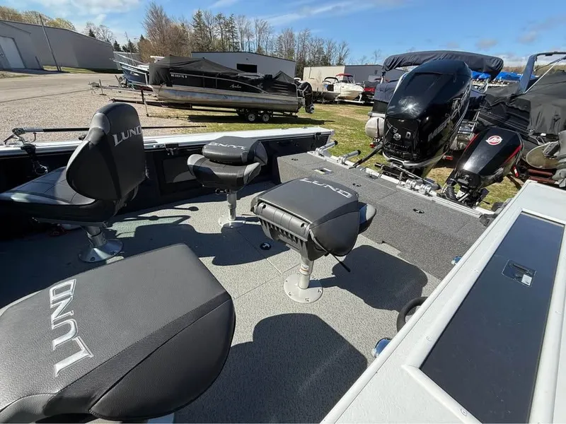 Slide: The Image of Interior of a 2020 Lund 2175PROV boat with seats and engines. - 6