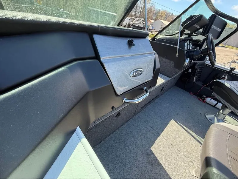 Slide: The Image of Interior of a 2020 Lund 2175PROV boat with steering console. - 7