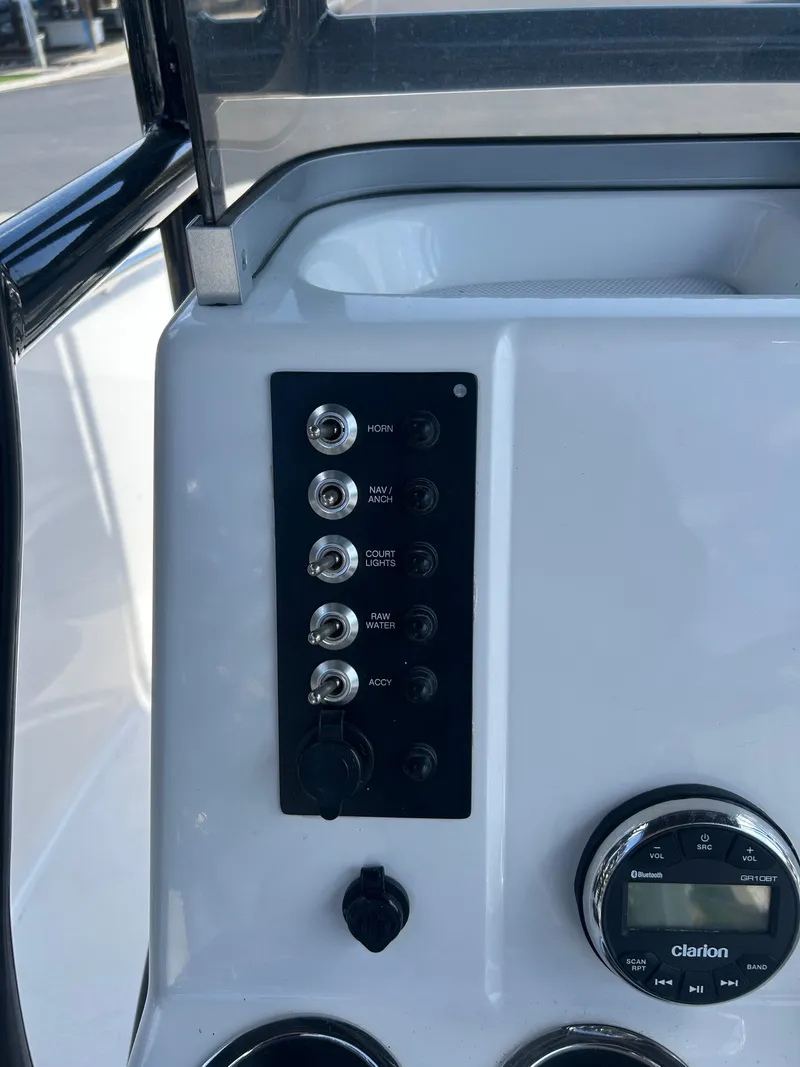 Slide: The Image of Control panel of 2018 Robalo R180CC boat with Clarion radio. - 15