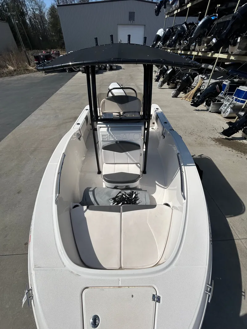 Slide: The Image of 2018 Robalo R180CC boat parked outdoors. - 17