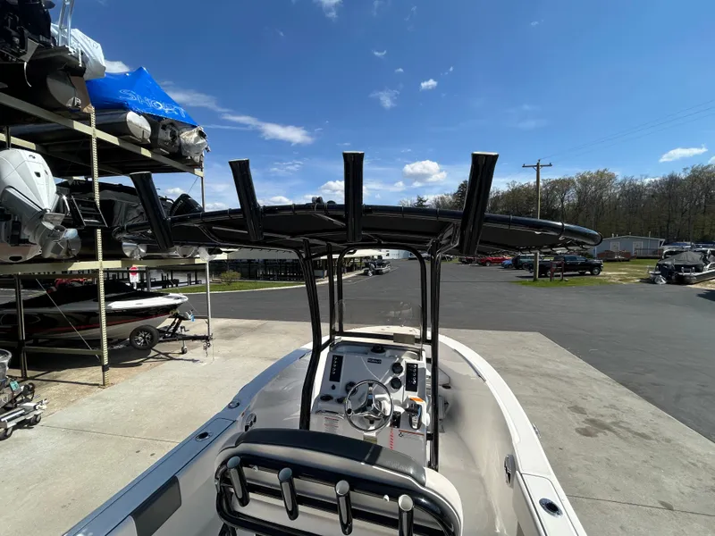 Slide: The Image of 2018 Robalo R180CC boat in a parking lot under sunny skies. - 19