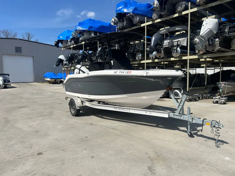 Slide: The Image of 2018 Robalo R180CC boat on trailer outdoors. - 4