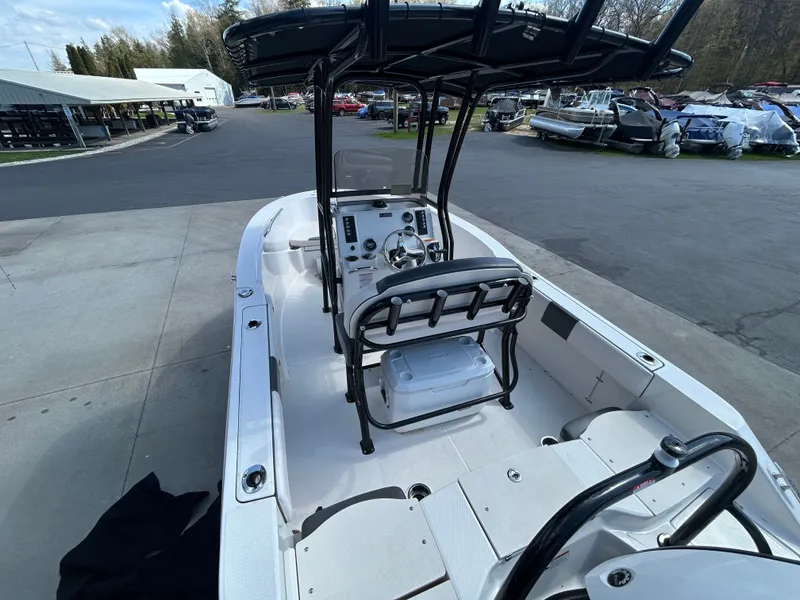 Slide: The Image of 2018 Robalo R180CC boat at dock, interior cockpit view. - 6