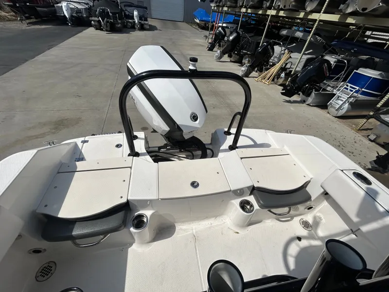 Slide: The Image of Robalo R180CC 2018 boat rear view with motor and seating area. - 7