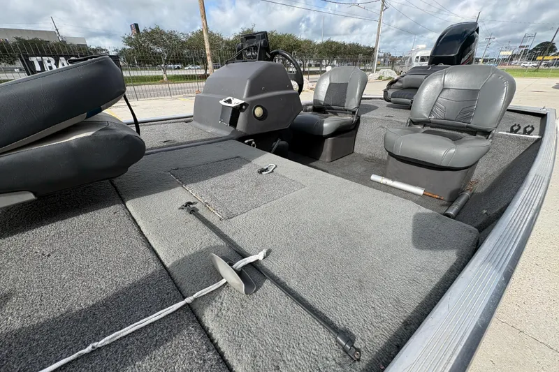 Slide: The Image of 2020 Tracker Bass Tracker Classic XL boat interior with gray seating and carpeted deck. - 12