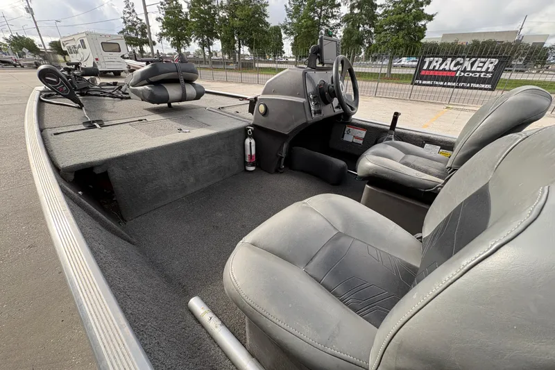 Slide: The Image of 2020 Tracker Bass Tracker Classic XL boat interior with seating and steering console. - 13