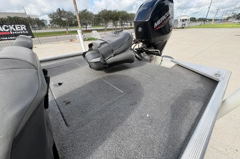 Slide: The Image of 2020 Tracker Bass Tracker Classic XL boat with Mercury engine, featuring spacious deck and seating. - 14