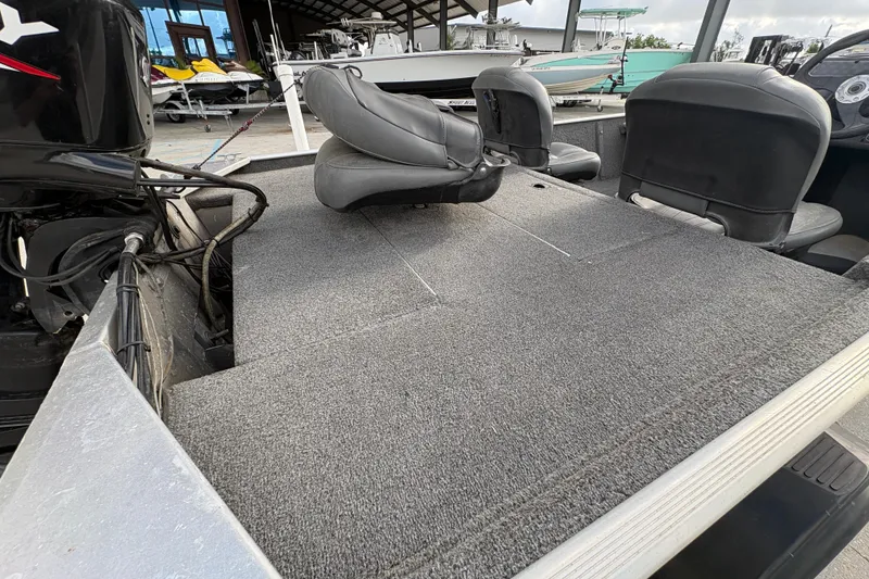 Slide: The Image of 2020 Tracker Bass Tracker Classic XL boat interior with seating and carpeted deck. - 16