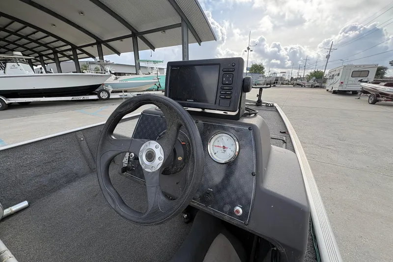 Slide: The Image of 2020 Tracker Bass Tracker Classic XL boat dashboard with steering wheel and navigation system. - 18