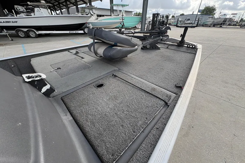 Slide: The Image of 2020 Tracker Bass Tracker Classic XL boat interior with fishing seat and storage compartments. - 19