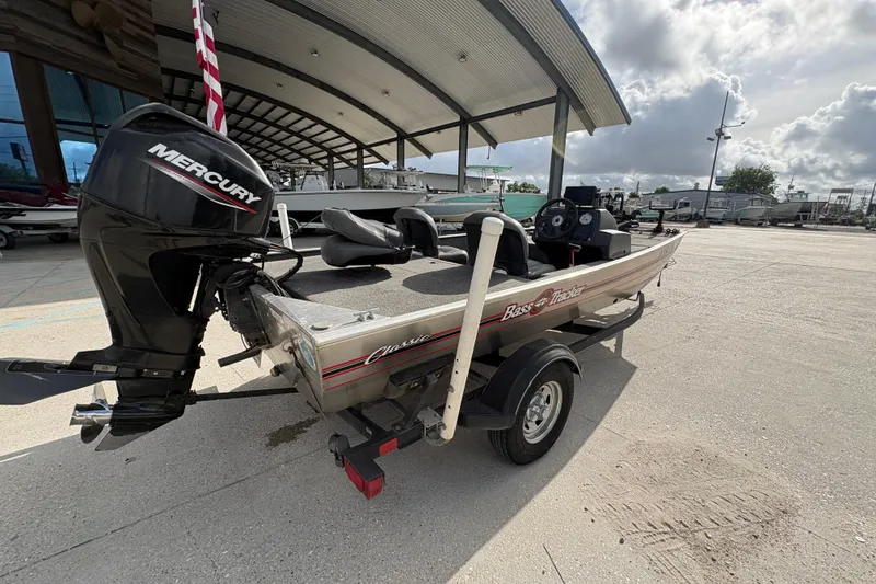 Slide: The Image of 2020 Tracker Bass Tracker Classic XL boat with Mercury engine, parked outdoors. - 3