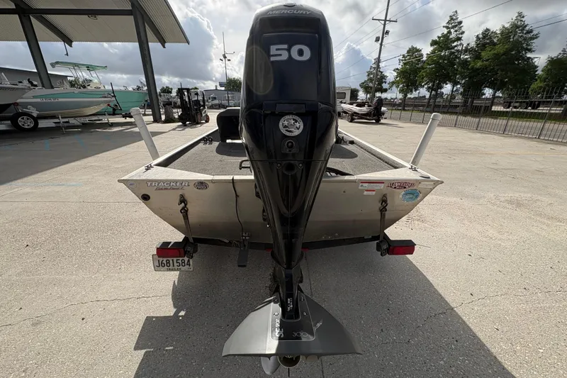 Slide: The Image of 2020 Tracker Bass Tracker Classic XL with Mercury 50 outboard motor, parked outdoors. - 4