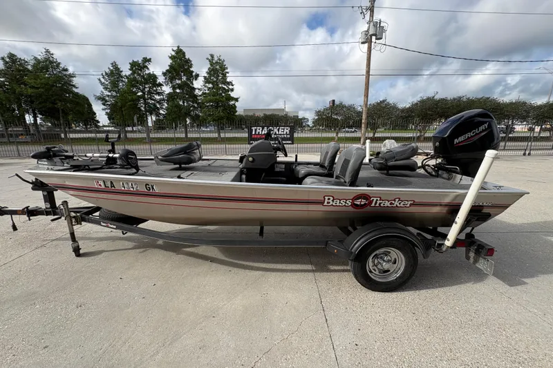 Slide: The Image of 2020 Tracker Bass Tracker Classic XL boat on trailer, parked outdoors. - 6