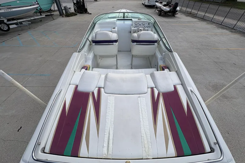 Slide: The Image of 2002 Formula 292 FASTech boat interior with colorful upholstery and dual seating. - 12