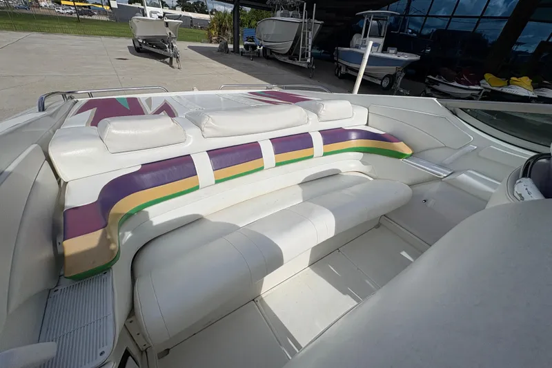 Slide: The Image of 2002 Formula 292 FASTech boat interior with colorful seating and sleek design. - 13
