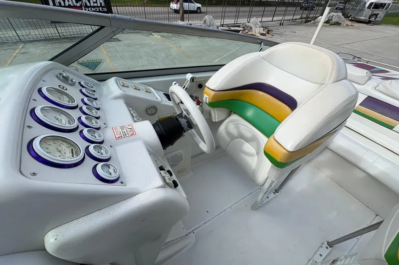 Slide: The Image of 2002 Formula 292 FASTech boat cockpit with colorful seat and detailed instrument panel. - 15