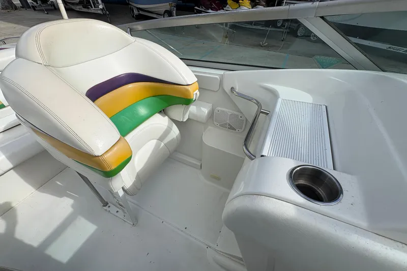 Slide: The Image of 2002 Formula 292 FASTech boat interior with colorful seating and cup holder. - 16
