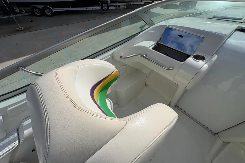 Slide: The Image of Interior of a 2002 Formula 292 FASTech boat with white seating and dashboard. - 17